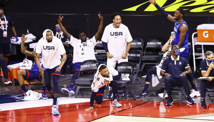 USA players celebrate during the second half of an exhibition basketball game against Argentina ...
