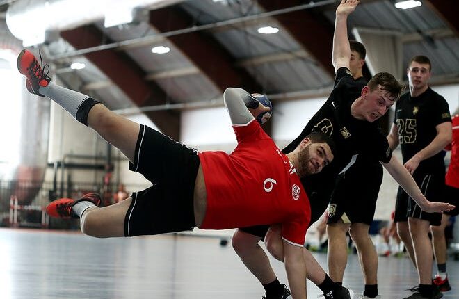 Boston Team Handball's Mustaga El-Farra finds a creative way to fire a shot.