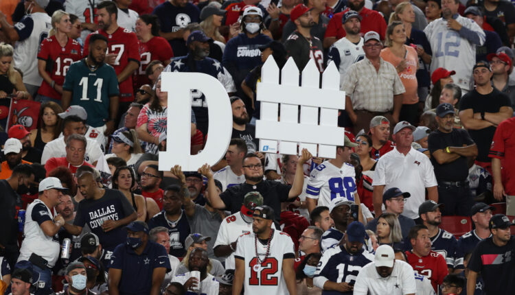 The Latest: Crowded sport stadiums, virus combustible mix