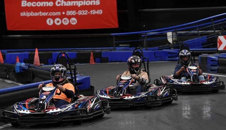 The Day - Local celebrities and politicians go-kart race for charity