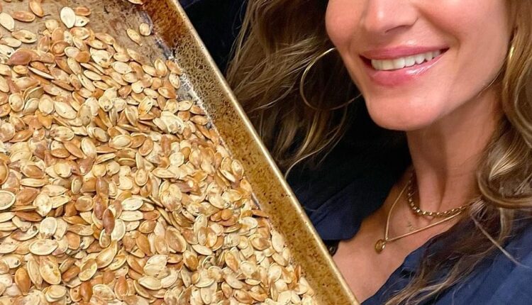 Happy Thanksgiving from my home to yours: Vogue supermodel Gisele Bundchen was baking pumpkin seeds for her husband Tom Brady and their kids. 'Getting the best out of pumpkin season!' began the Versace catwalker
